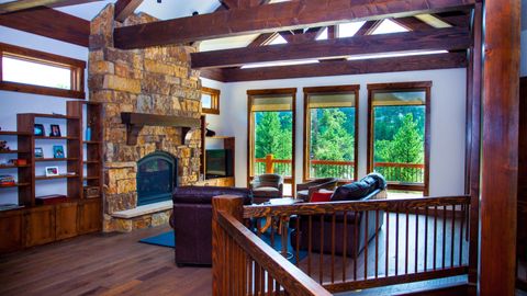 interior of cabin with stone fireplace