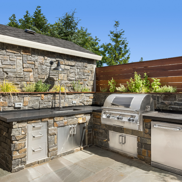 outdoor kitchen with stone surround