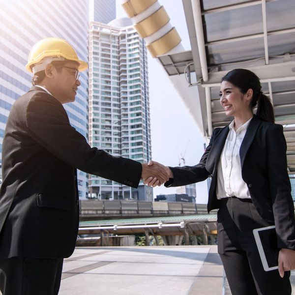 contractor shaking hands with client contractor shaking hands with client