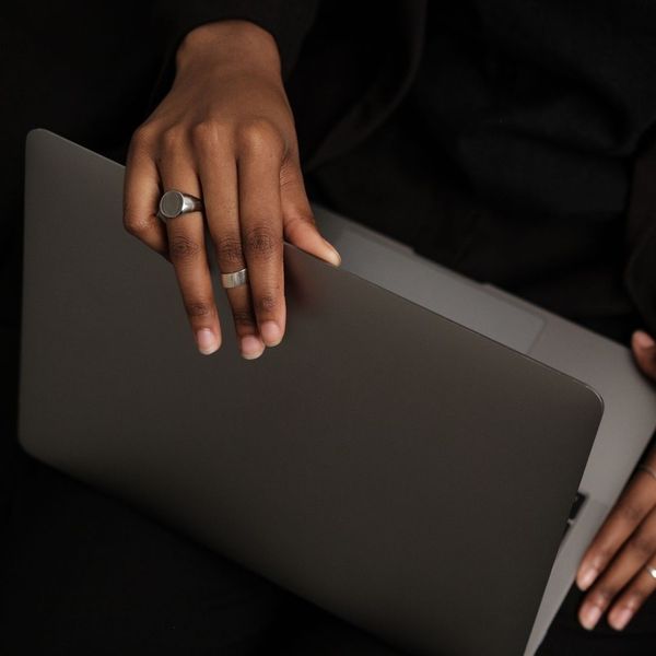 person closing their laptop