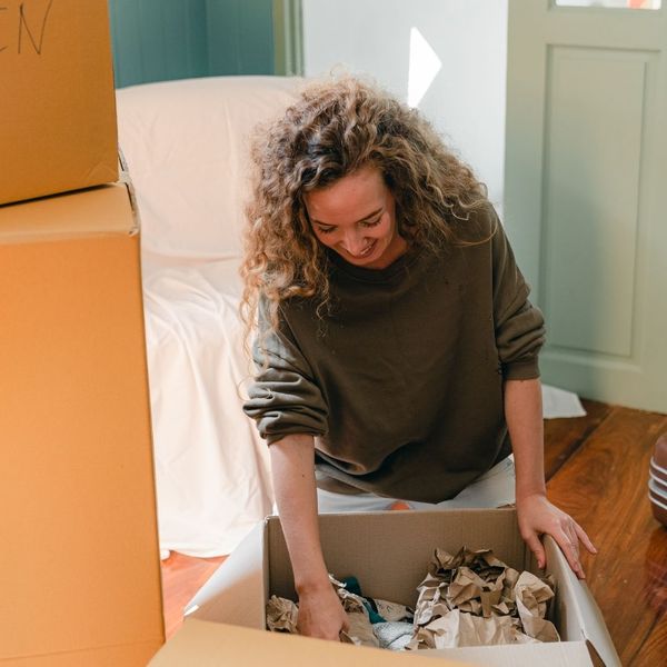 woman unpacking a box