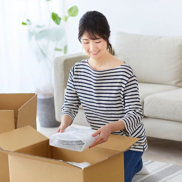 woman unpacking boxes