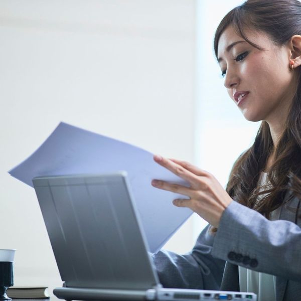woman looking at paperwork