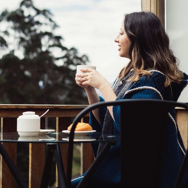 woman sitting on a balcony