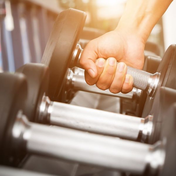 person grabbing a weight