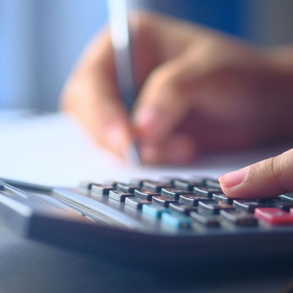person using a calculator person using a calculator