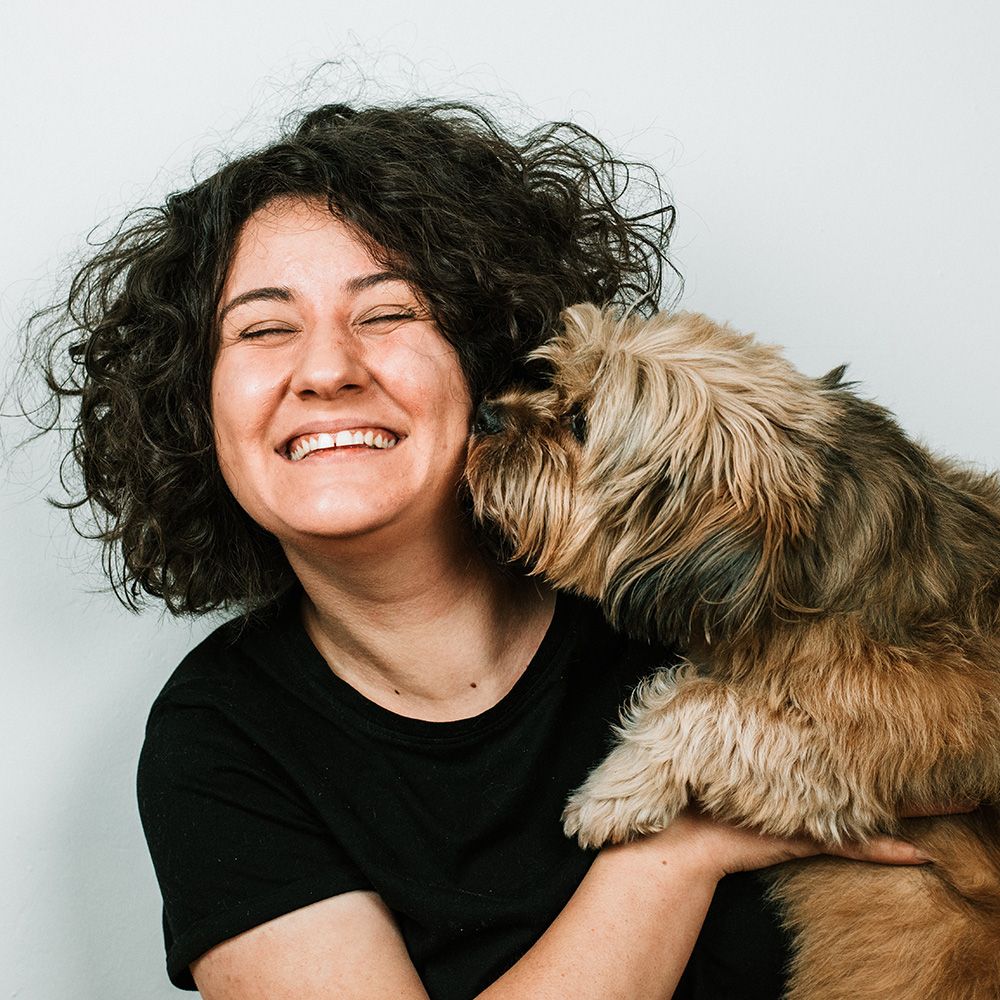 Woman smiling with her dog