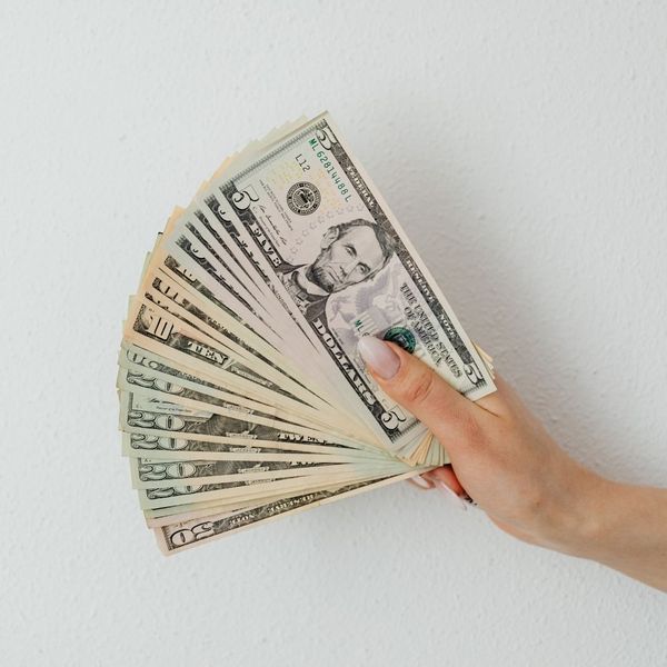 person holding cash