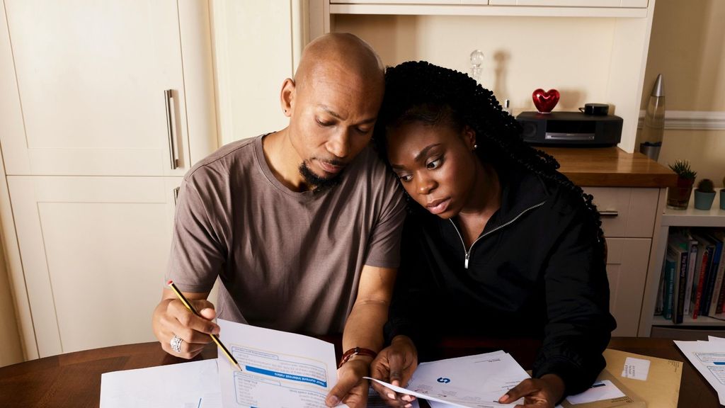 couple looking at bills