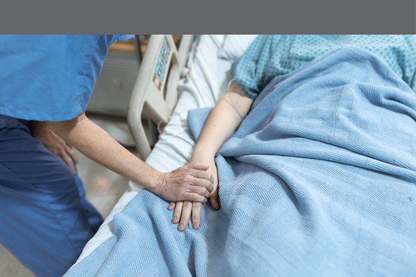 nurse holding patients han
