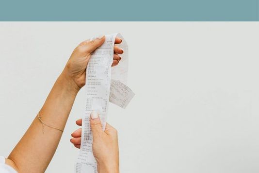 person holding receipt