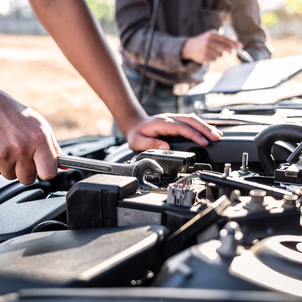 Car mechanics working