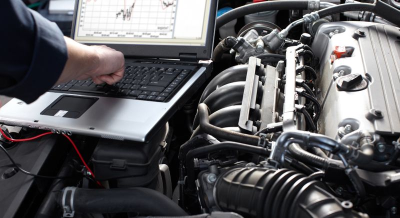 Mechanic using a laptop