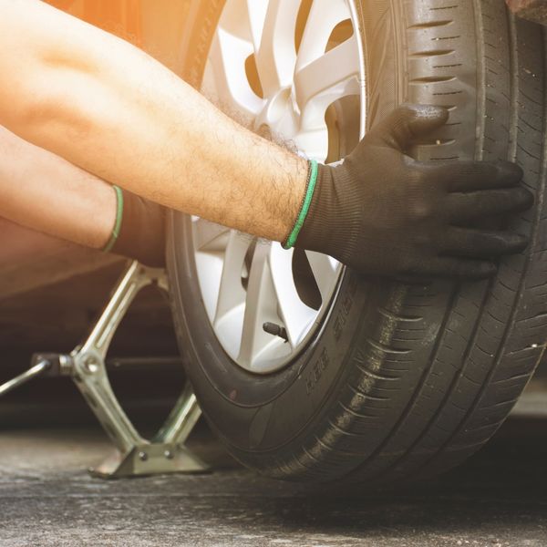 Man installing a new tire