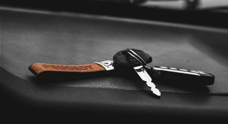 Car keys resting on a leather seat