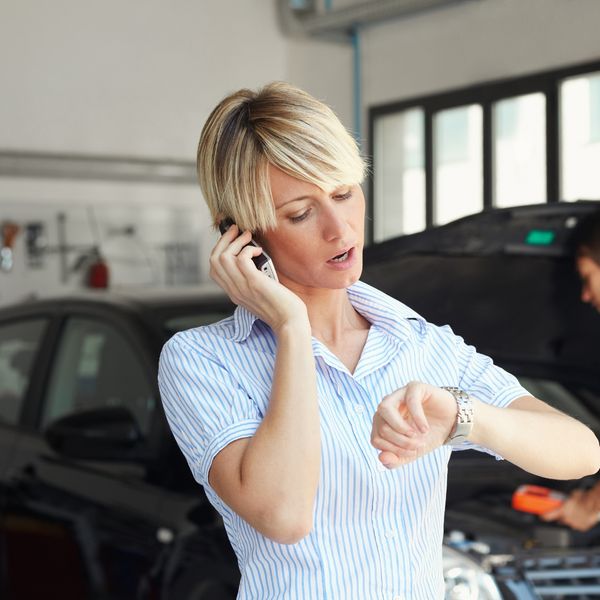 Woman calling a car mechanic