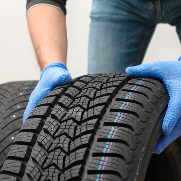 Person grabbing a tire