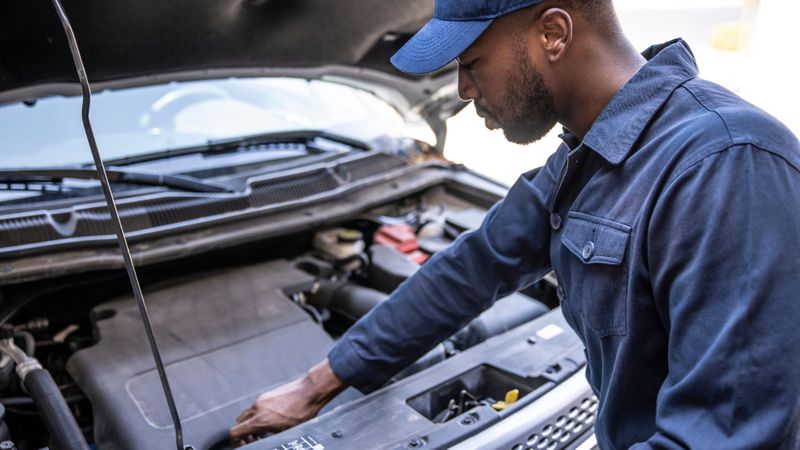 mechanic working on car