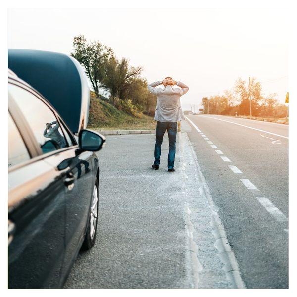 A stranded person on the side of the road 