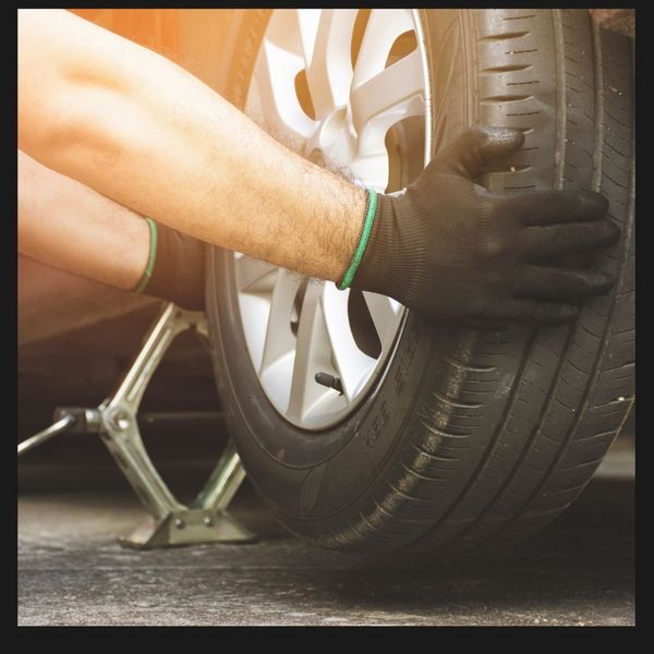 A mechanic fixing a tire