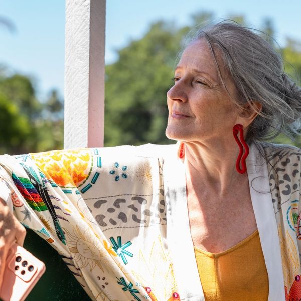 Older woman sitting outside