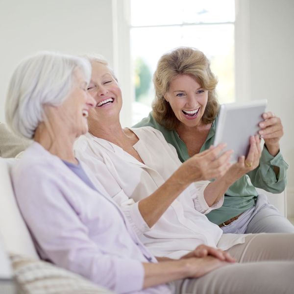 Older women smiling at a tablet