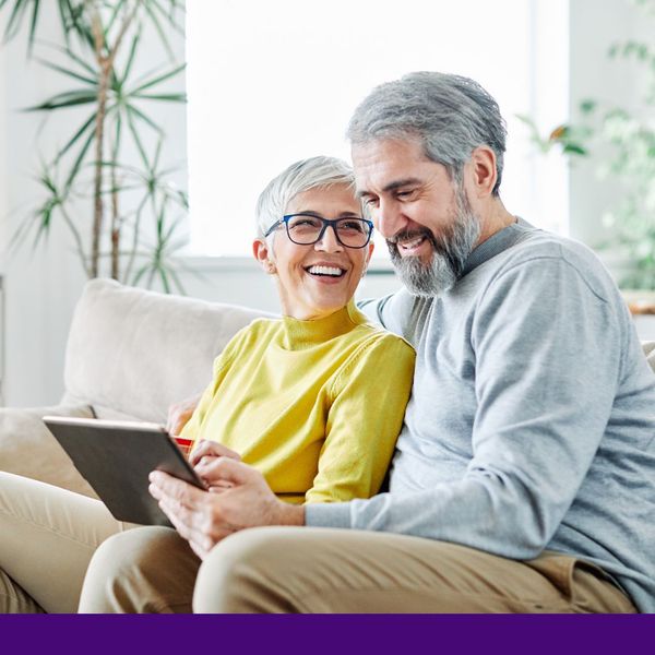 senior couple using tablet