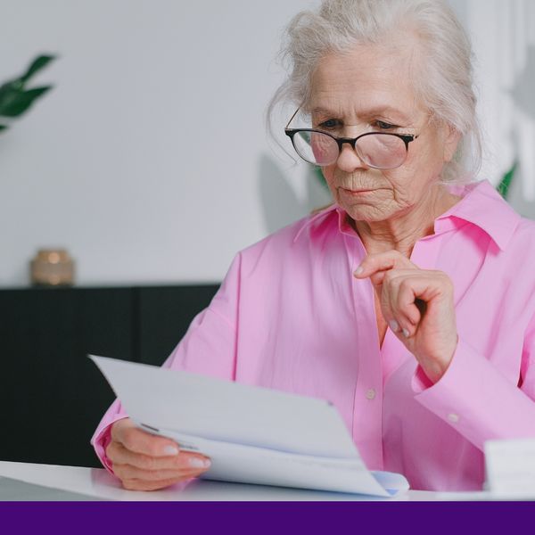 Senior Looking at document Senior Looking at document