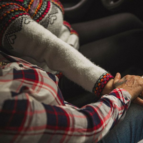 Older couple holding hands