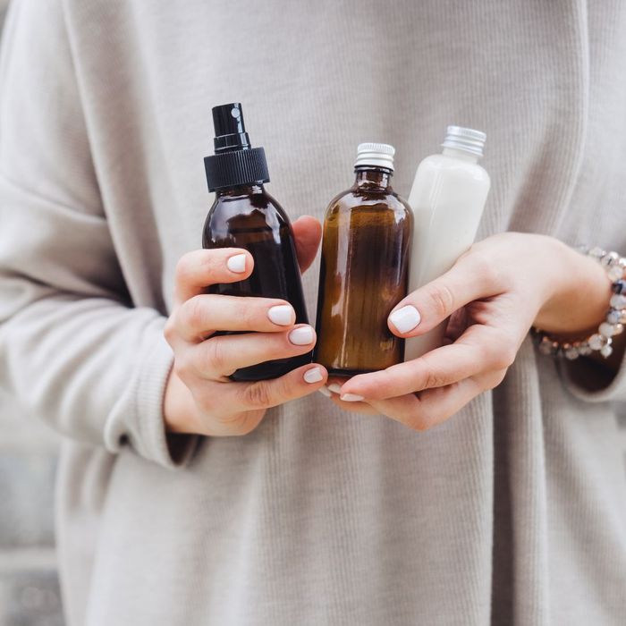 person holding beauty products