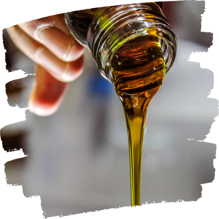 oil serum being poured out of bottle
