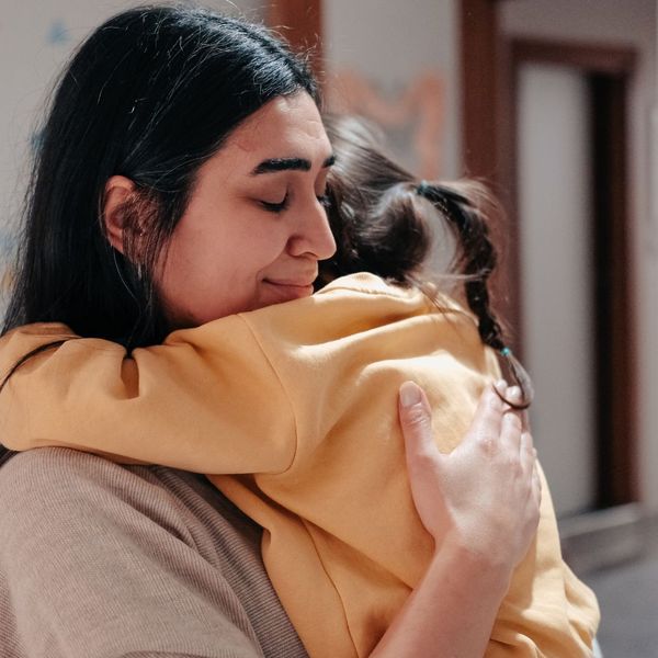 mom hugging daughter
