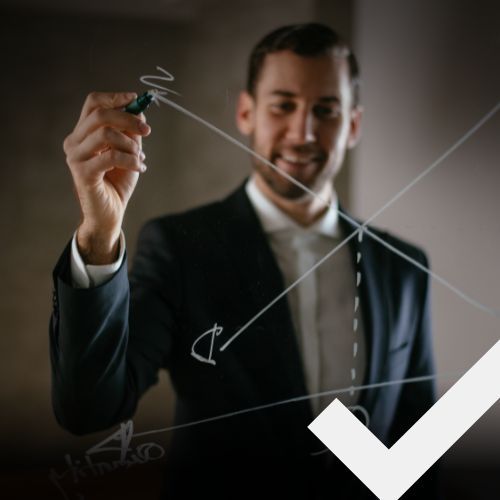 Businessman drawing economy chart