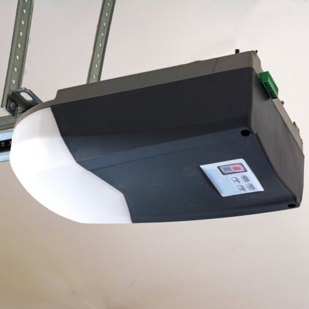 A sleek, modern, quiet garage door opener mounted cleanly on the ceiling of a garage.