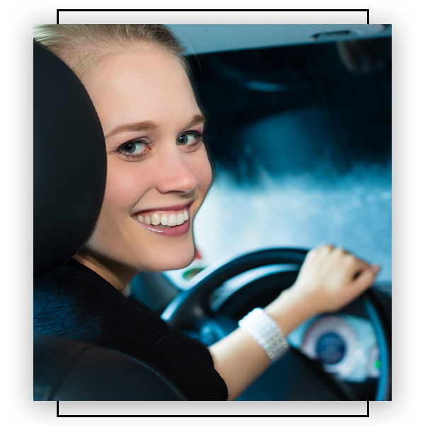 Woman smiling in car