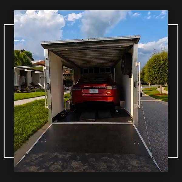 trailer delivering car after service