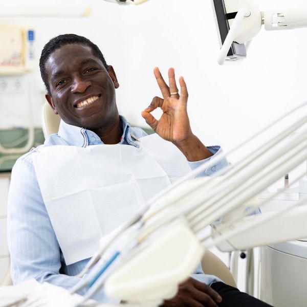 man smiling in dental chair 