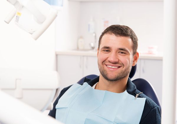 man smiling in dentist chair