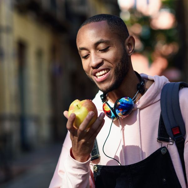 man eating apple