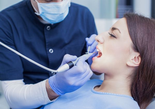 woman getting dental exam