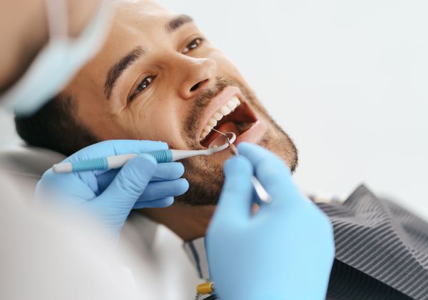 man getting dental exam