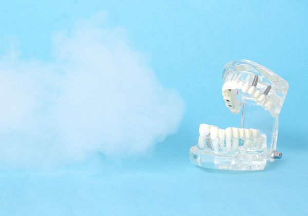 dental jaw model on a blue background with ozone