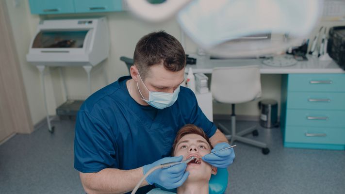 teenager getting dental cleaning