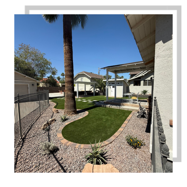 backyard with artificial turf, concrete borders, gravel, plants, pavers, and a gazebo