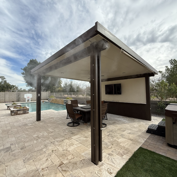 pergola misting system with outdoor furniture on paver patio