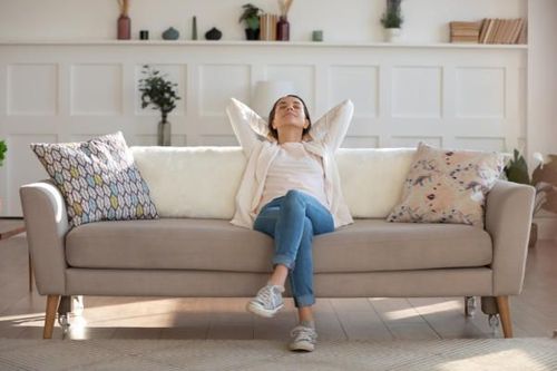 Woman leaning back on couch.jpg