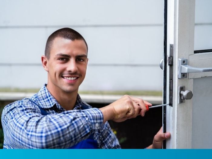 locksmith working on door