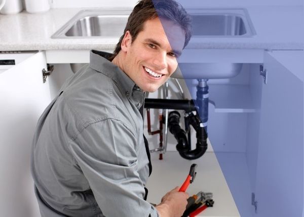 Plumber smiling during installation
