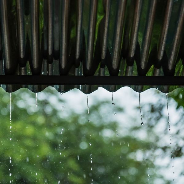 Rain hitting a roof.