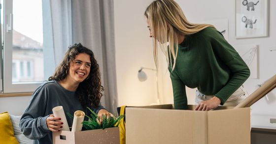 roommates unpacking boxes